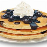 Blueberry Pancakes · Topped with whipped cream.