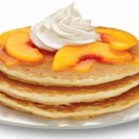 Peach Pancakes · Topped with whipped cream.