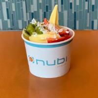 Tropical Paradise · Pineapple froyo with coconut, kiwi, and strawberry toppings.