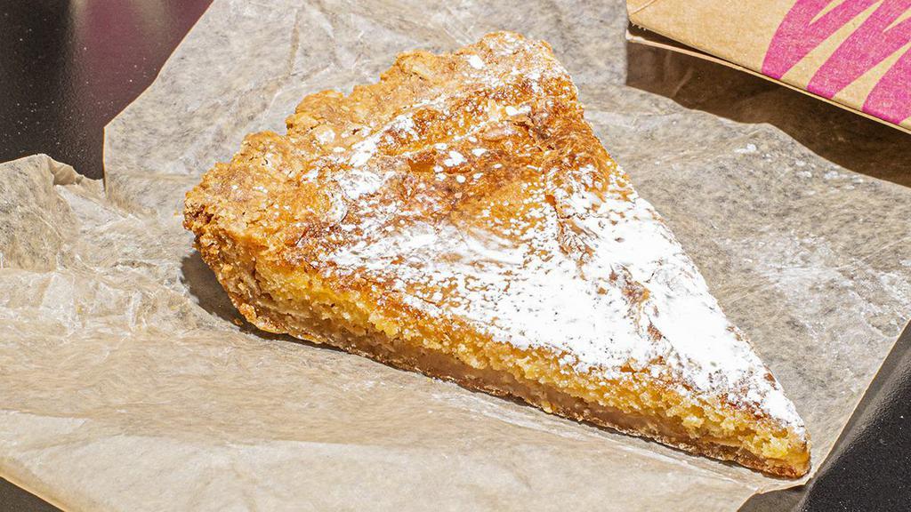 Milk Bar Pie Slice · A slice of our namesake pie. Gooey, buttery goodness in a hearty toasted oat cookie crust — sweet, salty, and sticky.