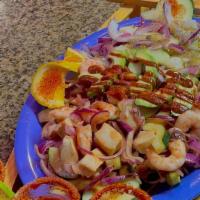 Camarones Cucaracha · Head on shrimp served with our aguachile dipping sauce.