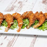 Coconut Prawn · Hand breaded large prawns coated with coconut flakes served with honey mayo and walnuts.