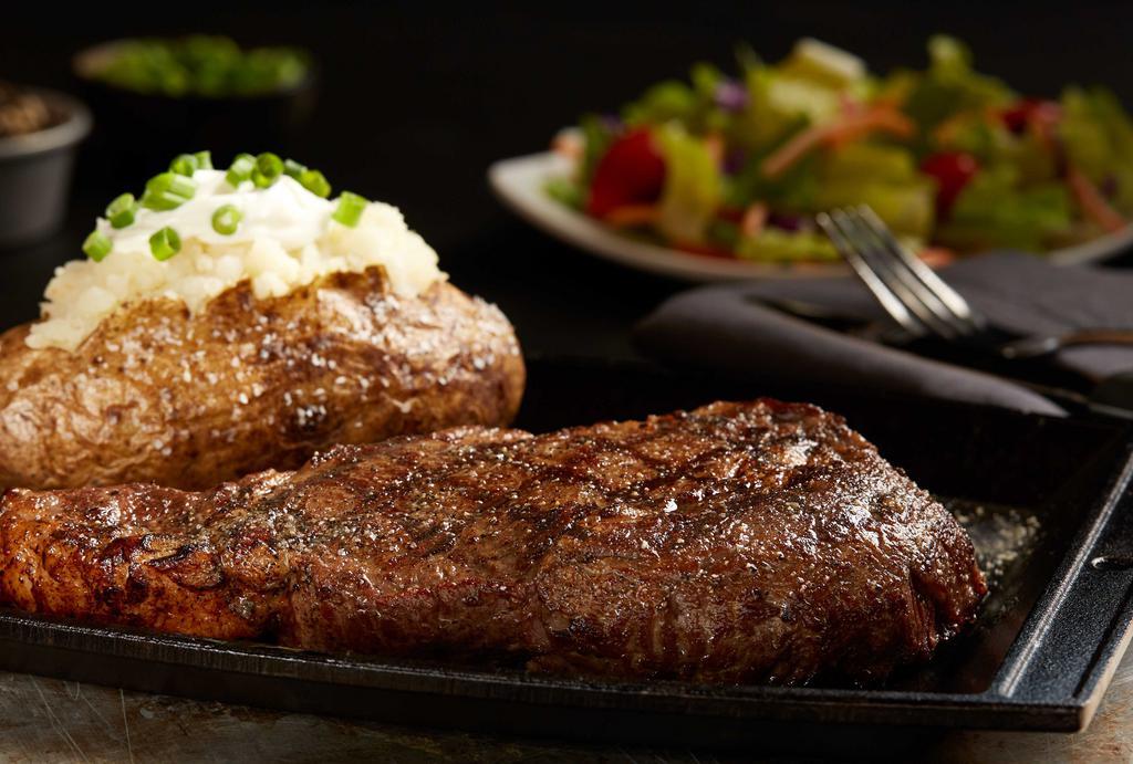 14 Oz. Ribeye Steak · Well marbled, tender and delicious. Served with choice of any one side. 1055 cal.
