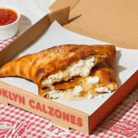 Brooklyn Calzone · Classic calzone with creamy ricotta cheese and mozzarella cheese, and a side of marinara. (v)