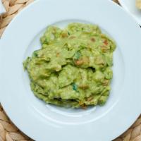 Guacamole Dip · Freshly smashed avocado, diced tomatoes, cilantro and onions served with crispy tortilla she...
