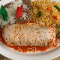 Carne Asada Burrito · Marinated steak, shredded cheese, and refried beans topped with red sauce and melted cheese....