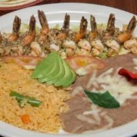 Camarones Al Mojo De Ajo · Shrimp sautéed in our special garlic and butter sauce. Served with slice of tomato and avoca...
