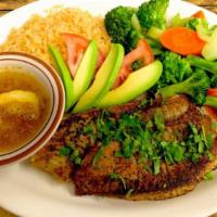 Grilled Tilapia · Grilled Tilapia fillet topped with slices of tomato and avocado and cilantro.