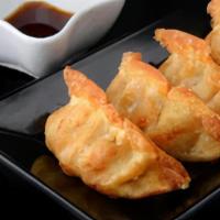 Deep Fried Pot Stickers (6 Pieces) · Deep Fried Pot stickers with pork and vegetables inside.