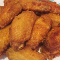 Fried Chicken Wings (8 Pieces) · Fried chicken wings flat.