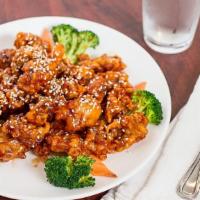 Crispy Sesame Chicken · Chunks of chicken dipped in lotus flour, fried then stir fried in an exquisite sweet sesame ...