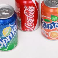 Soft Drinks · Soft drink cans.