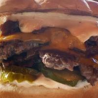 Smash Burger · Two beef patties, cheddar cheese, Caramelized onions, pickles, 1000 island dressing, potato ...