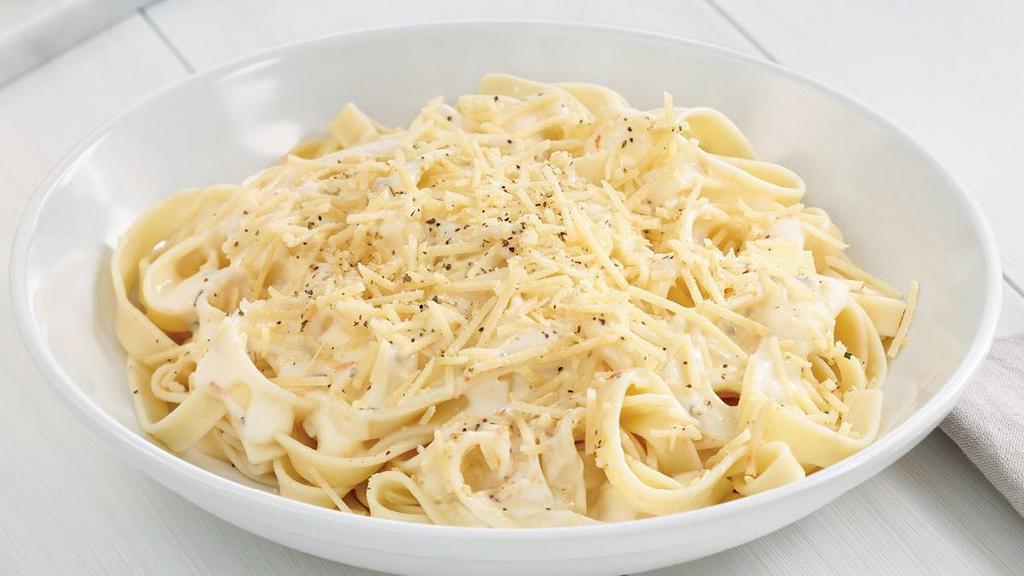 Fettuccine With Alfredo · Fettuccine topped creamy garlic and parmesan Alfredo sauce topped with shaved Parmesan cheese and Italian herbs.. Includes 2 of our Signature Garlic Breadsticks