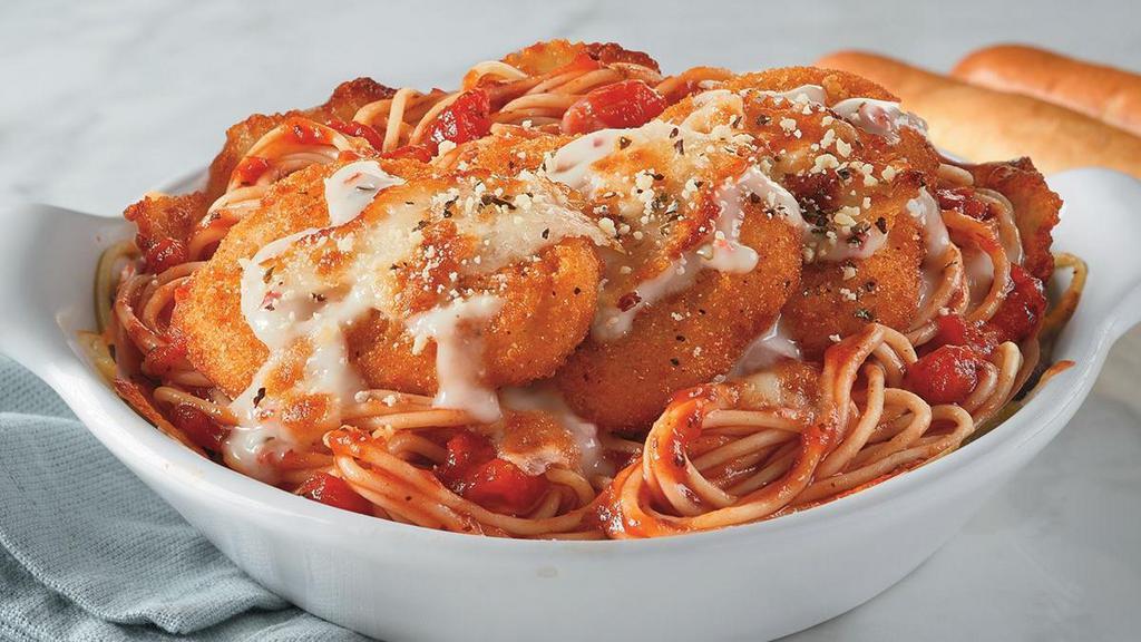 Chicken Parmigiano · Spaghetti covered in Marinara Sauce with Crispy Chicken Breast covered with Alfredo Sauce, Mozzarella and Provolone Cheeses and baked.. Includes 2 of our Signature Garlic Breadsticks. If you're looking to add an additional side or toppings, please visit the Sides/Extras section of the menu..