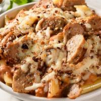 Spicy Baked Ziti With Sausage · Penne pasta topped with spicy tomato pepper sauce, Italian sausage, and baked with mozzarell...