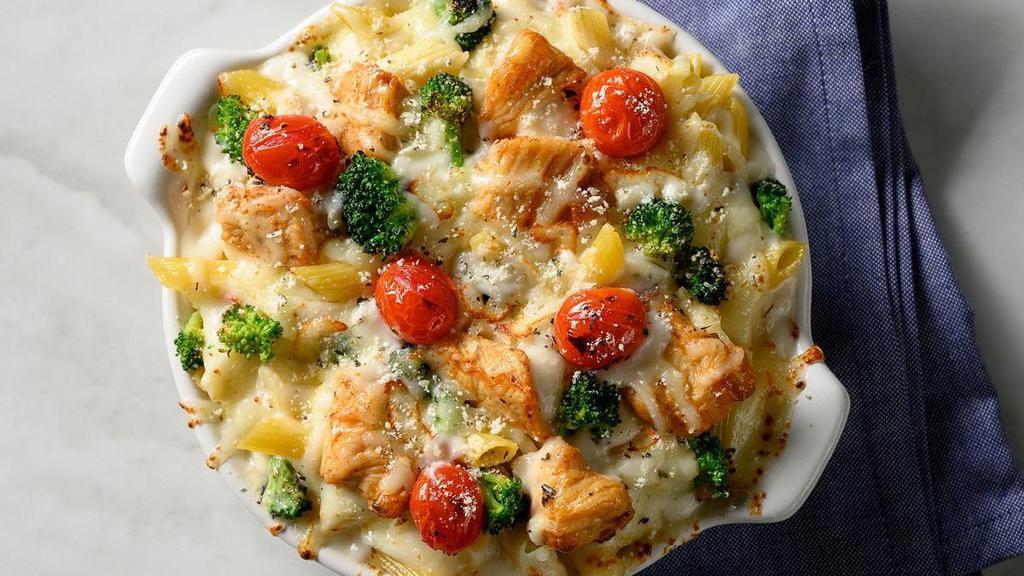 Chicken Broccoli Penne · Chicken, Broccoli, Roasted Grape Tomatoes, Alfredo Sauce, Mozzarella, Provolone and Parmesan Cheeses.. Includes 2 of our Signature Garlic Breadsticks. If you're looking to add an additional side or toppings, please visit the Sides/Extras section of the menu.