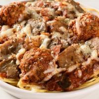 Loaded Baked Spaghetti · Spaghetti topped with meat sauce, meatballs, mushrooms, Italian sausage, and bacon.  Baked w...