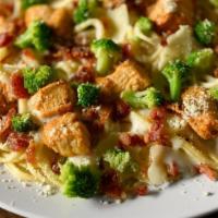 Chicken Carbonara · Spaghetti topped with creamy Alfredo sauce with hand-chopped bacon, roasted chicken, and par...