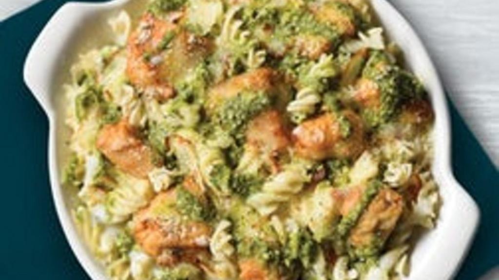 Gluten Friendly Chicken Pesto Rotini · Gluten friendly rotini topped with Alfredo sauce, roasted chicken, and baked with mozzarella cheese.  Topped with basil pesto..