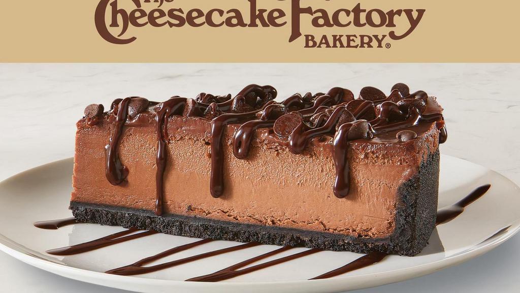 The Cheesecake Factory Bakery Triple Chocolate Cheesecake · Chocolate Cheesecake on a chocolate crust made by The Cheesecake Factory Bakery topped with chocolate chips and drizzled with chocolate sauce.