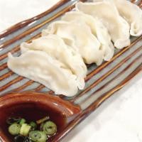 Steamed Dumpling · Choice chicken or vegetable served with sweet black sauce.