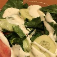 Garden Salad · Mixed greens, carrots, cucumbers, and tomatoes with your choice of dressing. Add Caesar dres...