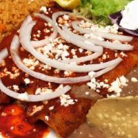 Ench-Rancheras · Two enchiladas filled with shredded beef, smothered with ranchero sauce topped with jack and...