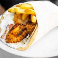 Chicken Souvlaki Pita · Seasoned chicken cubed and skewered on a stick, cooked over open flame, stick removed and se...
