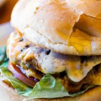 Grecian Beefteki Burger · 1/3 pound beef and pork patty seasoned to perfection, with Kasseri cheese served on a bun wi...