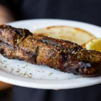 Pork Souvlaki On A Stick · Seasoned pork cubed and skewered on a stick, cooked over an open flame and served with a min...