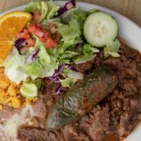 Bistek Picado · Diced steak with tomato, onion and bell pepper, served with rice, beans & salad