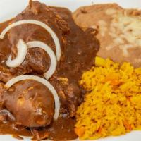 Gallina En Mole · chicken mole served with rice, beans