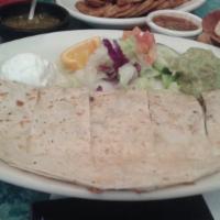 Quesadillas · flour or corn tortilla filled with melted cheese