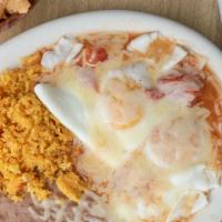 Huevos Rancheros · ranch style eggs served with rice & beans