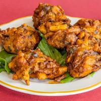 Vegan Mixed Vegetable Pakora · Vegetarian. Assorted vegetables mixed with chickpea dough and spices deep-fried.