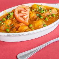 Vegan Aloo Matar · Vegan. Peas and potatoes cooked with spices and herbs.