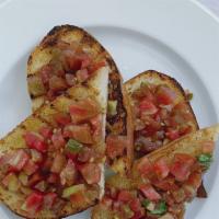 Tomato Bruschetta · grilled crostino, chopped tomatoes, garlic, basil