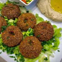 Falafel Plate · Six pieces of falafel served with hummus, salad, and pita bread.
