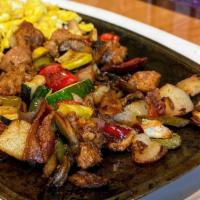 Breakfast Skillet · Fresh zucchini, onion, mushrooms, potatoes and bell peppers served on a sizzling platter wit...