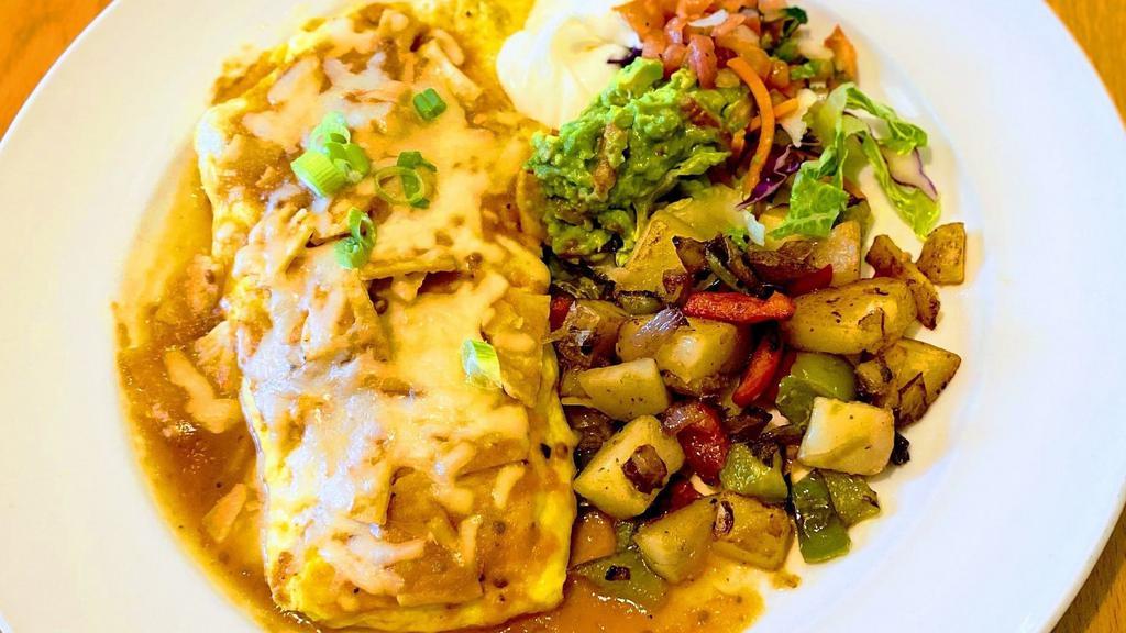 Mexican Omelette · Three egg omelette filled with chorizo, bacon, tomato, bell peppers, mush rooms, onion, and topped with red sauce, guacamole, and tortilla strips. Served with breakfast potatoes, and a side of sour cream and pico de gallo.