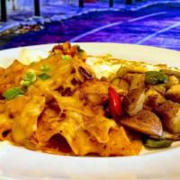 Machaca Plate · A savory blend of shredded pork, eggs, onion, bell pepper, jalapeños and red sauce. Served w...