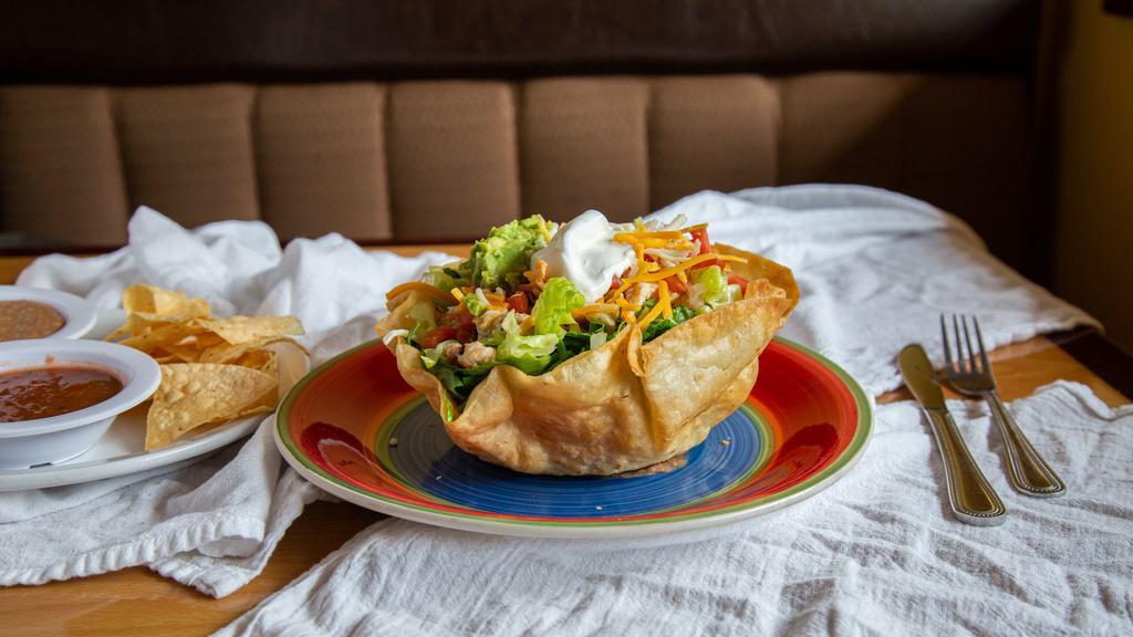 Taco Salad · Your choice of carnitas, chicken, ground beef or asada served in a crispy bowl with refried beans, lettuce, pico de gallo, cheese, and topped with sour cream and guacamole.