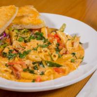 Pasta Mexicana · Shrimp, chicken and habanera sausage sautéed with onion, tomato and garlic. Tossed with penn...