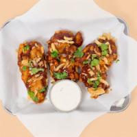 Honey Bbq Tenders · Three crispy fried chicken tenders slathered in Honey BBQ with scallions and fried onion str...