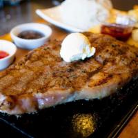 Ribeye Steak (10 Oz) · Served with a salad and two sides. Order rare, stone will continue cooking steak. Stone is h...