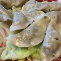 Mandu (Dumplings) (만두) · Dumplings mixed with vegetable and meat (pork & beef). 7 pieces included.