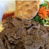 Lamb Gryo Plate · Persian style lamb Gyro, fresh veggies, creamy tzatziki sauce, and peta cheese are nestled i...