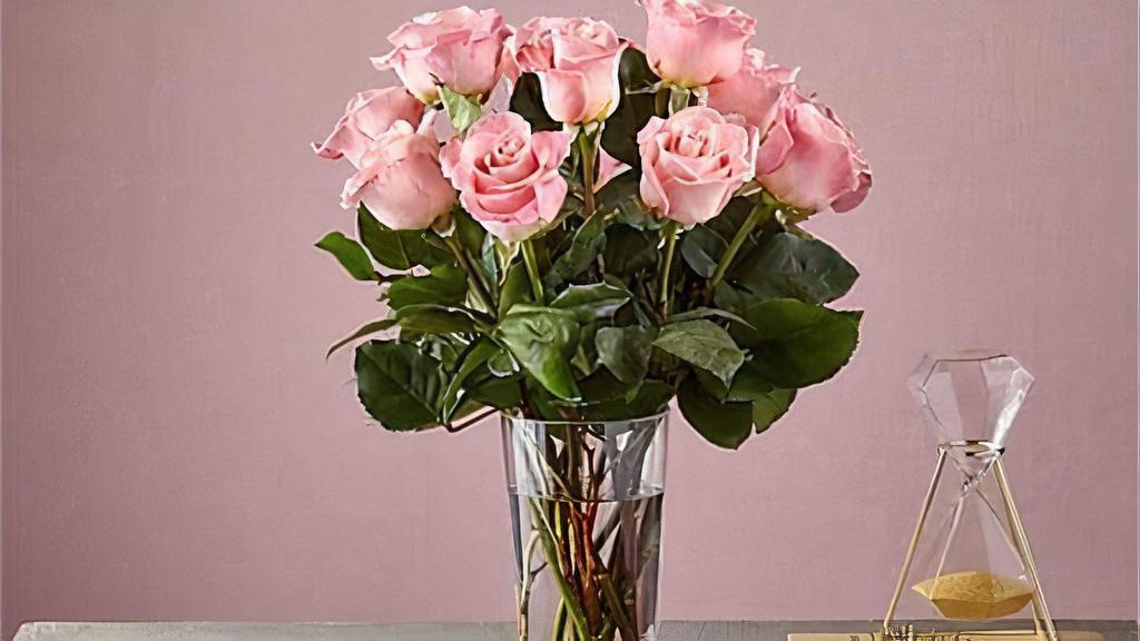 12 Long Stem Pink Roses · Enjoy the classic Beauty of the rose with a playful twist in our Long Stem Pink Rose Bouquet. This arrangement features 12 pink roses that will look especially pretty in the hands of those you cherish most. Vase included. Item # E5440S