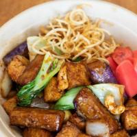 Wok-Fried Tofu · Sautéed tofu with eggplant, bok choy, onion, and cashew nuts and topped with roasted sesame ...